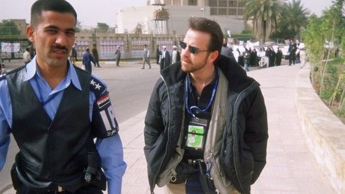 Interviewing the only police officer assigned to hold back a crowd that was growing behind us every minute.
Fardos Square, Baghdad - 2004 (The History Channel)