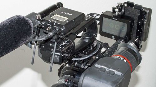 This rig was designed by cameraman Gaetan Mariage to have the same form factor as a betacam type or ENG camera. It allows for one-man operation, key element in investigative journalism and low budget productions, while combining the highest standards of video technology with photographic optical quality. It's compact and modular design makes it suitable for any kind of filming configuration.

The EOS C100 uses the same Super 35mm Canon CMOS sensor and DIGIC DV III image processor as its big brother, the C300. 
Picture profiles based on Canon's Cinema Log can be created and tweaked on-the-fly. 
For slo-mo, the 1080i60 can be de-interlaced to 30p or 24p, giving a similar result than the C300's internal 720p60.

The Atomos NINJA 2 records 1920x1080 24p//30p/60i directly from the camera's sensor to a SSD in Apple's ProRes edit-ready codecs. 
The Ninja-2 encodes in real-time to 10-bit, 4:2:2 Apple ProRes at up to 220Mbps. No conversion process needed, ready for editing and color grading. 
Back-up recording is provided by the camera's internal AVCHD codec.

LENS MOUNT:
It's EF lens mount makes the camera compatible with the full range of Canon lenses and third party high quality lenses such as Zeiss and Voigtlander.
EVF:
A heavy duty Electronic Viewfinder with Retina quality was added and calibrated to provide optimal monitoring in shoulder operation mode. 
POWER:
This system is designed by Anton Bauer to provide power to the C100. It also powers the NINJA recorder and the EVF.