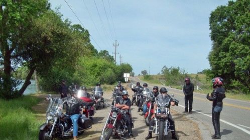 Lisa Rentuor (at right), the lead female part of Jill Arnold in Ride to Iron Mountain, gives instructions to the team before our road trailer shoot. 