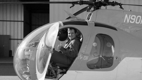 Flying a MD-500 (Hughes 369) series helicopter. 